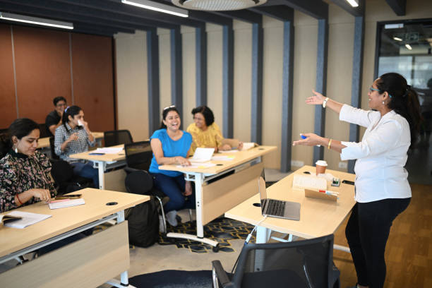 istock Female Instructor teaching mature adult students in the classroom 1429679299