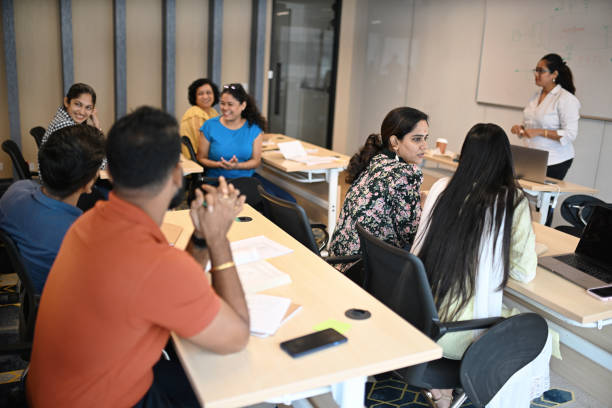 istock Female Instructor teaching mature adult students in the classroom 1429679468