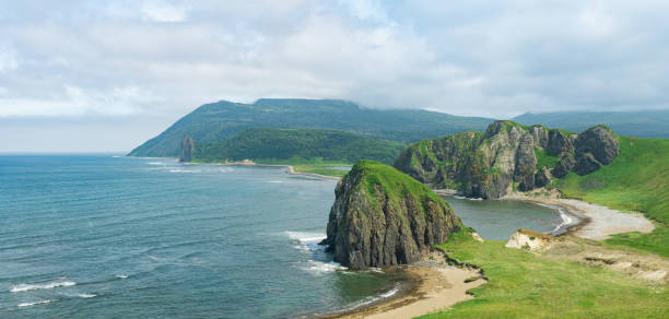 aerial view of the beautiful coastline of Kunashir island with basalt cliffs aerial view of the beautiful coastline of Kunashir island with basalt cliffs kunashir island stock pictures, royalty-free photos & images