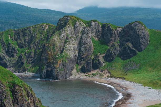 istock coastal landscape, wild bay with sandy beach between basalt rocks 1429683834