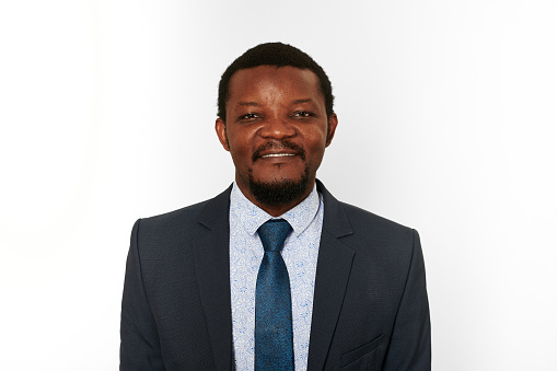 Smiling african american black man in business suit isolated on white background. Happy black executive businessman, chief executive officer satisfied with successful deal with business partners