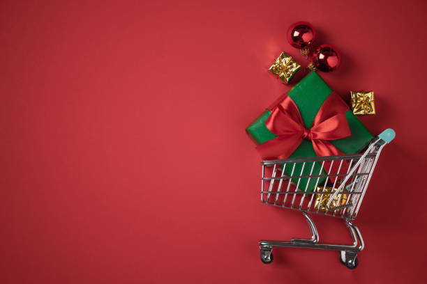istock Shopping cart with Christmas presents top view. 1429686851