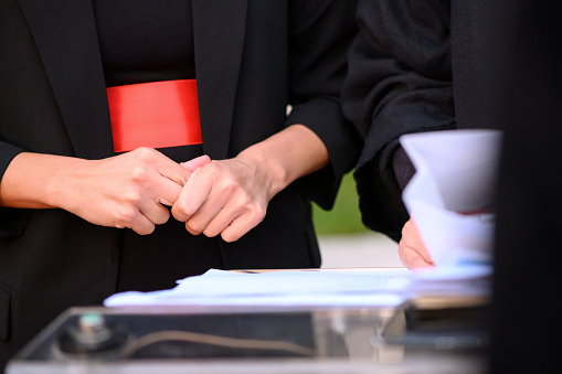 Insecure woman standing in front of the lectern