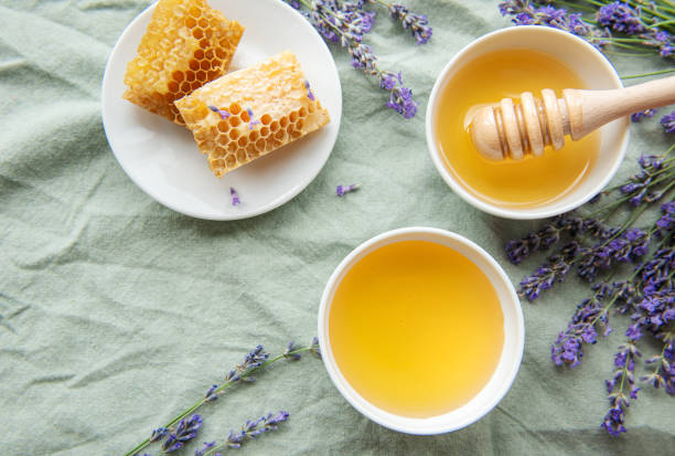 istock Jar with honey and fresh lavender flowers 1429693899