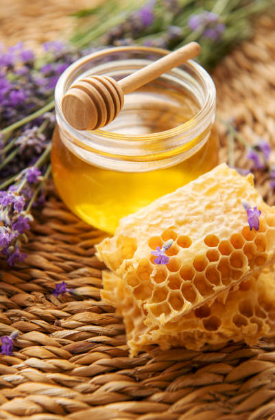 istock Jar with honey and fresh lavender flowers 1429693906