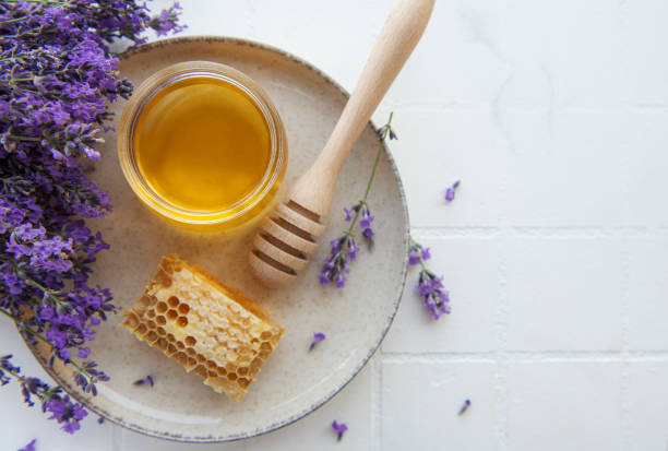 istock Jar with honey and fresh lavender flowers 1429693917