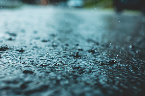 Raindrops on asphalt. Rain. Rainy weather. Downpour