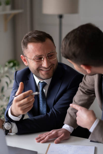 istock Two young businessmen discuss or plan project in office 1429700920