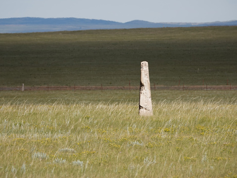 Trail markers for the Historic 19th century Overland Trail across the wide open prairies of  Southern Wyoming.