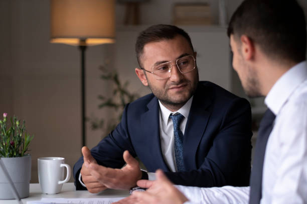 istock Two young businessmen discuss or plan project in office 1429702409