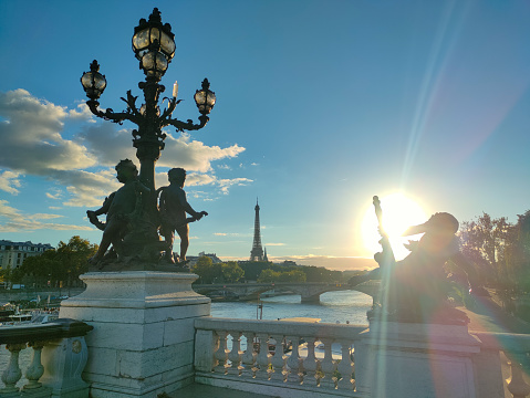 Close-up  view of Pont Alexandre-III and its golden sculptures at sunset in Paris