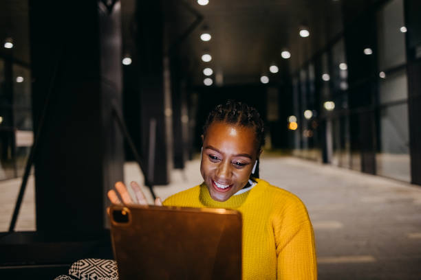 istock Woman uses a tablet in a dark street 1429709103