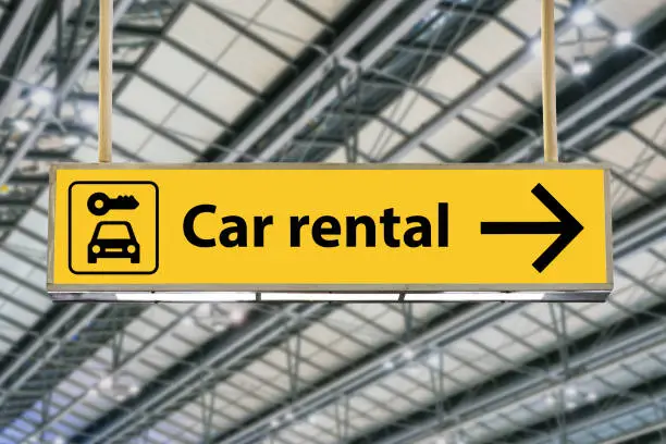 Car rental sign. Sign with arrow point to rent a car service at the airport.