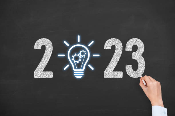 istock Human Hand Drawing New Year 2023 Idea Solution Concepts on Blackboard Background 1429713105
