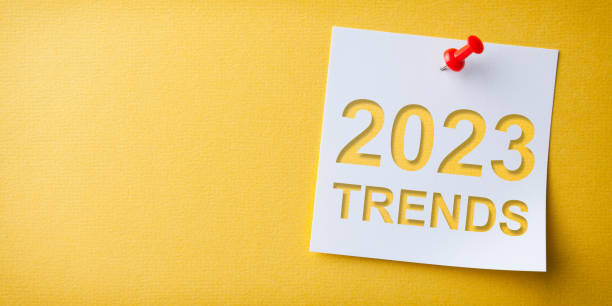 istock Trends 2023 Word in White Sticky Note on Yellow Cardboard Background 1429714719