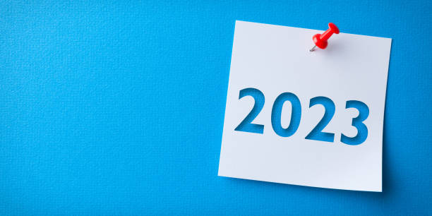 istock White Sticky Note With Happy New Year 2023 And Red Push Pin On Blue Cardboard Background 1429714908