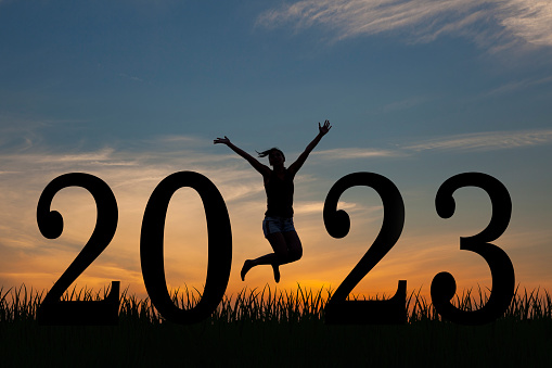 Silhouette young woman happy for 2023 new year