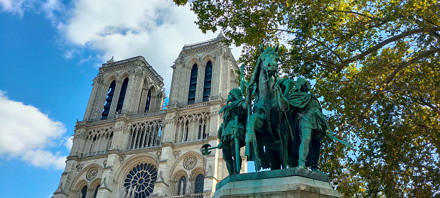 Low angle view of the Notre-Dame de Paris cathedral under a clear sky in Paris