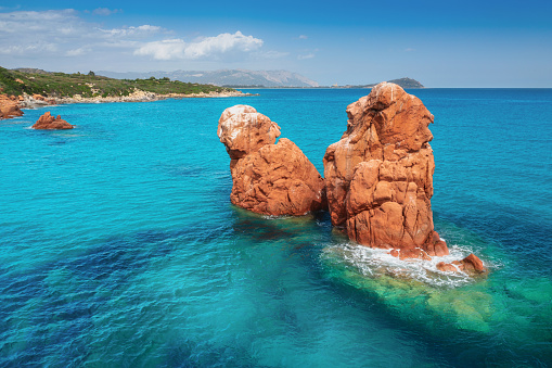 Summer seascape. Turquoise sea water with beautiful rocks closeup. Island of sardinia in Italy
