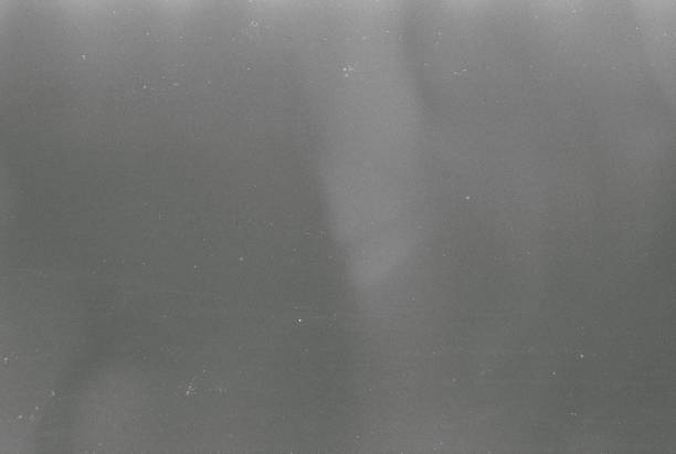 istock 400 Iso Black and white film grain background 1429728151