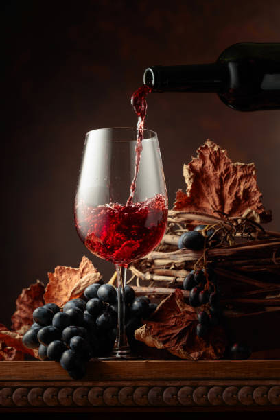 istock Wine is poured into a glass. 1429733115