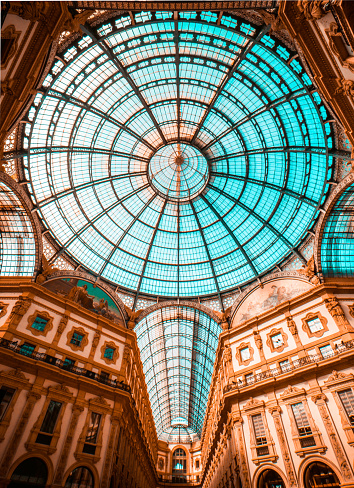 an Italy's oldest active shopping gallery and a major landmark of Milan in Italy. Housed within a four-story double arcade in the centre of town, the Galleria is named after Victor Emmanuel II, the first king of the Kingdom of Italy. It was designed in 1861 and built by architect Giuseppe Mengoni between 1865 and 1877.