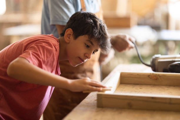 istock Grandfather and grandson in workshop 1429736812