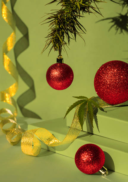 green podium of gift boxes golden ribbon. Christmas background with podium for cannabis products. cbd oil. stock photo