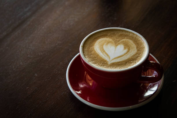 istock the red cup coffee love , coffee dark in wood dark table 1429740115