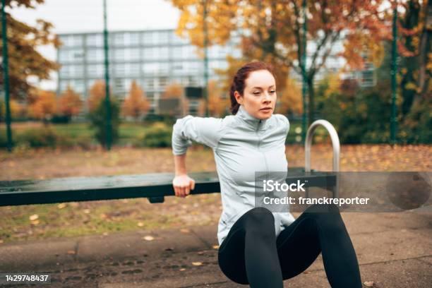 Sportive Woman Doing Pushups On The Park Stock Photo - Download Image Now - Active Lifestyle, Adult, Adults Only