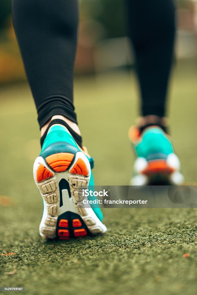 rear view of woman shoes running Outdoors Stock Photo