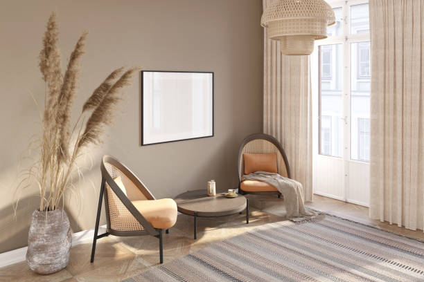 istock A cozy room in warm colors with a blank horizontal poster over a round coffee table, two rattan chairs, large spikelets in a clay vase, linen curtains by the window door, rug on the floor. 1429751113