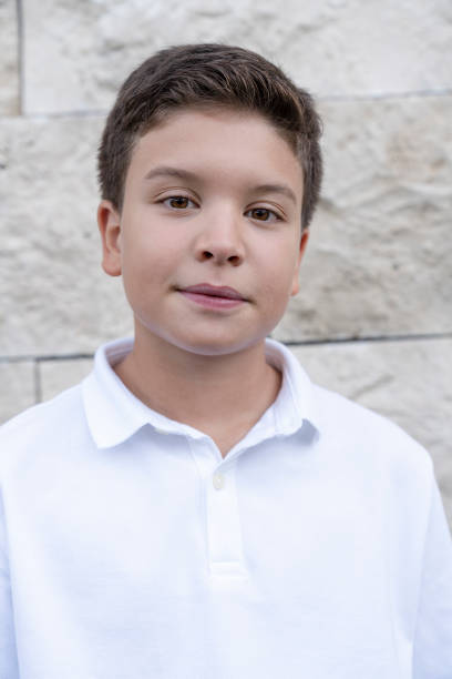 portrait of young boy looking at camera