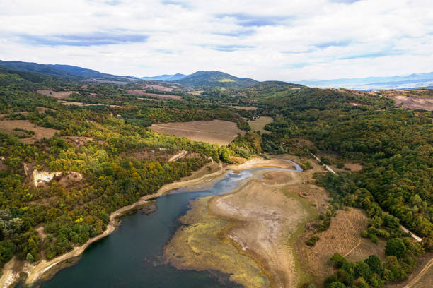 Dam inflow drying up due to drought and climate change, drone view stock photo
