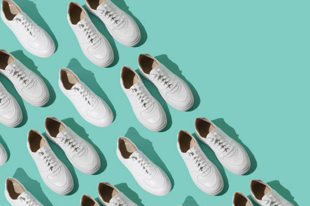 istock White sneakers pattern on background. The shoes are comfortable and casual. Background for a shoe store. 1429773374