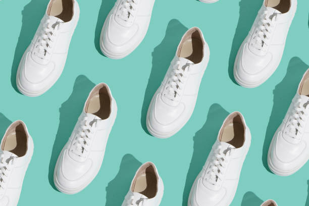 istock White sneakers pattern on background. The shoes are comfortable and casual. Background for a shoe store. 1429773376
