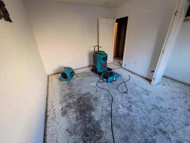 Water Damaged bedroom with carpet removed and air movers with a dehumidifier for drying Water Damaged bedroom with carpet removed and air movers with a dehumidifier for drying Water Damage Restoration stock pictures, royalty-free photos & images