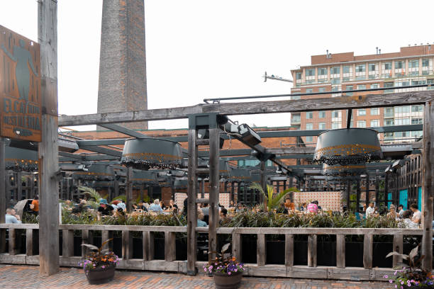Toronto, Ontario, Canada - August 22, 2025:  Toronto's Distillery District is a historically significant area of the downtown core.  In the past, as its name suggests, the area was devoted largely to distilling spirits.  Years ago, with the distillery business in sharp decline, the area was redeveloped into shops, restaurants, bars, theatres, galleries etc.  It brought together residential condos/apartments, and commercial enterprises into high end developments.  The area is now a tourist destination.