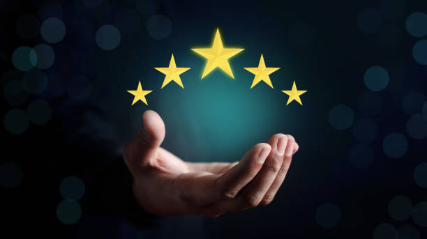 Businessman holding five stars for customer feedback and evaluation in experience service and product. Excellent rating. User give rating, good business network score.