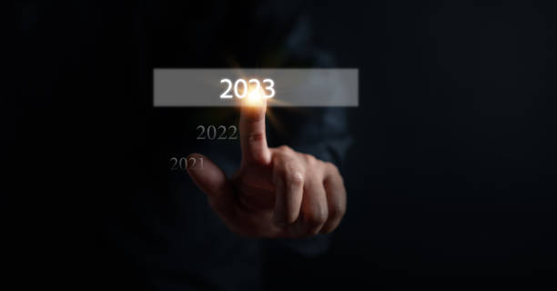 istock Businessman touching virtual screen on number 2023 for preparation and change to merry Christmas and happy new year concept. 1429809708