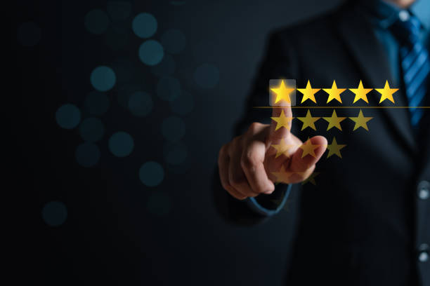 istock Customer businessman touching glowing illustration five stars rating service on virtual screen for satisfaction evaluation survey and review. 1429809868