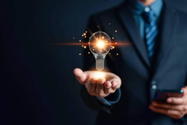istock Businessman holding virtual lightbulb for presenting new ideas. creative smart thinking ideas and innovation. Great inspiration and innovation new beginning concept. 1429810376