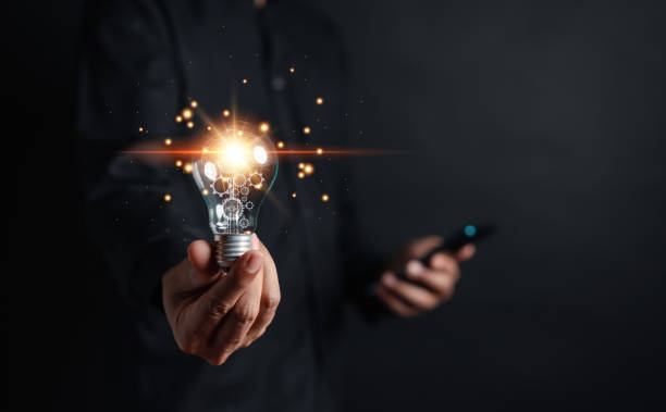 istock Great inspiration and innovation new beginning. creative smart thinking ideas and innovation. Businessman holding virtual lightbulb for presenting new ideas concept. 1429811518