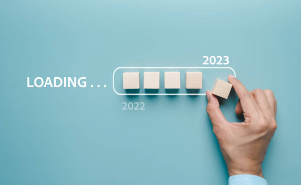 istock Hand putting wooden cube block for loading progress from 2022 to 2023 to countdown merry christmas and happy new year concept. 1429813277