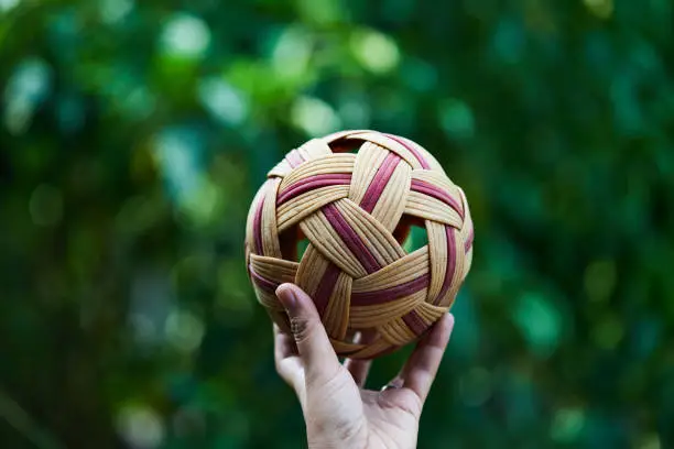 Photo of Hand holding Sepak Takraw