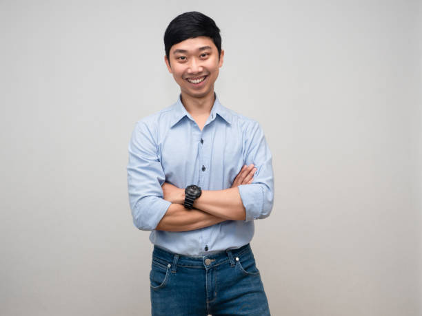 istock Handsome man happy smile crossed arms isolated 1429834903