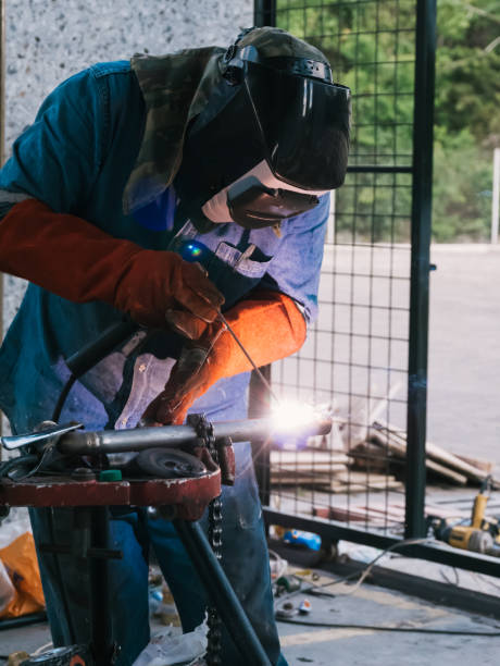 istock Iron soldering, Man working on iron soldering, welding sparks 1429836239