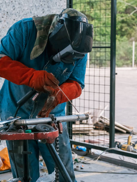 istock Iron soldering, Man working on iron soldering, welding sparks 1429837009