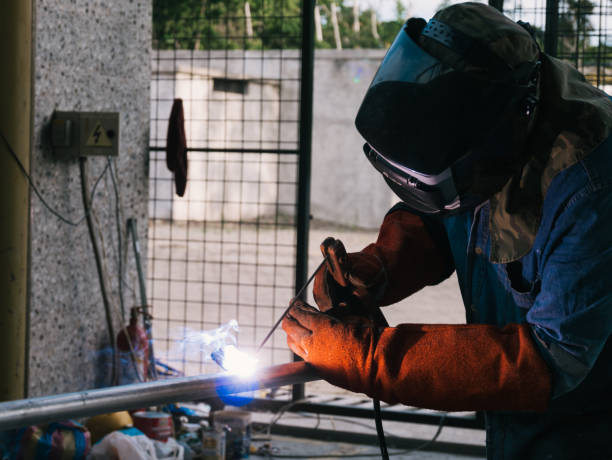 istock Iron soldering, Man working on iron soldering, welding sparks 1429837351