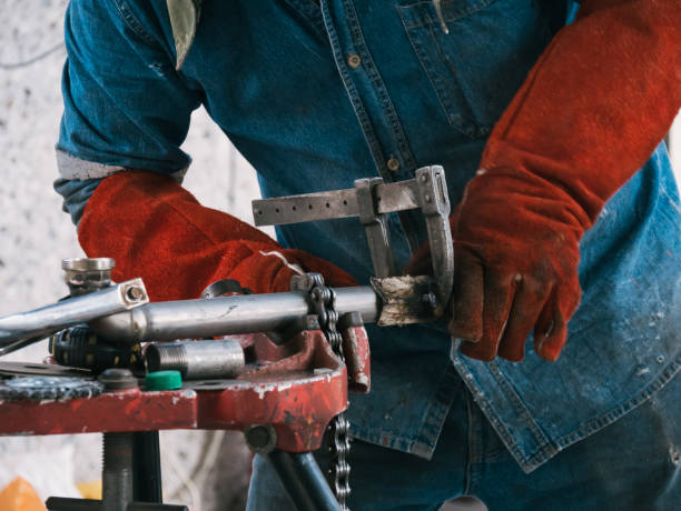istock Iron soldering, Man working on iron soldering, welding sparks 1429838520